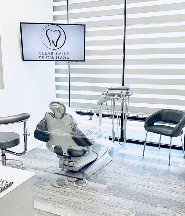 a clear smile dental studio with a dental chair