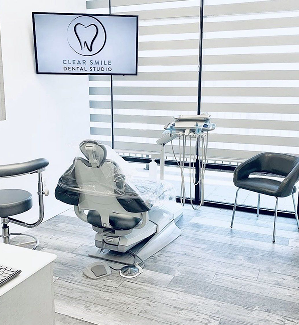 a clear smile dental studio with a dental chair