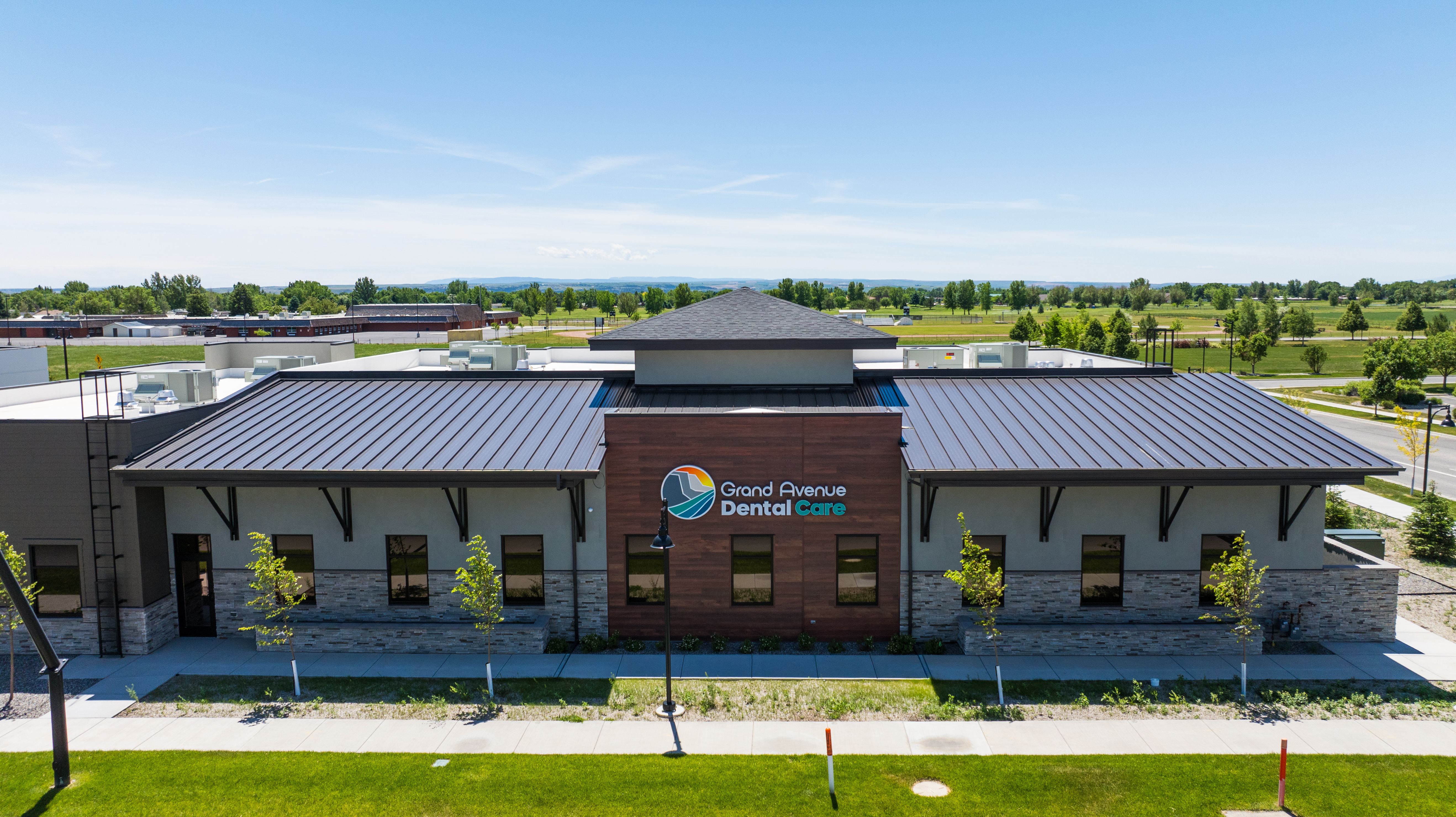 an aerial view of a dental office with a metal roof .