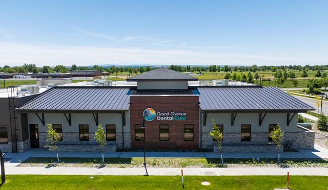 an aerial view of a dental office with a metal roof .