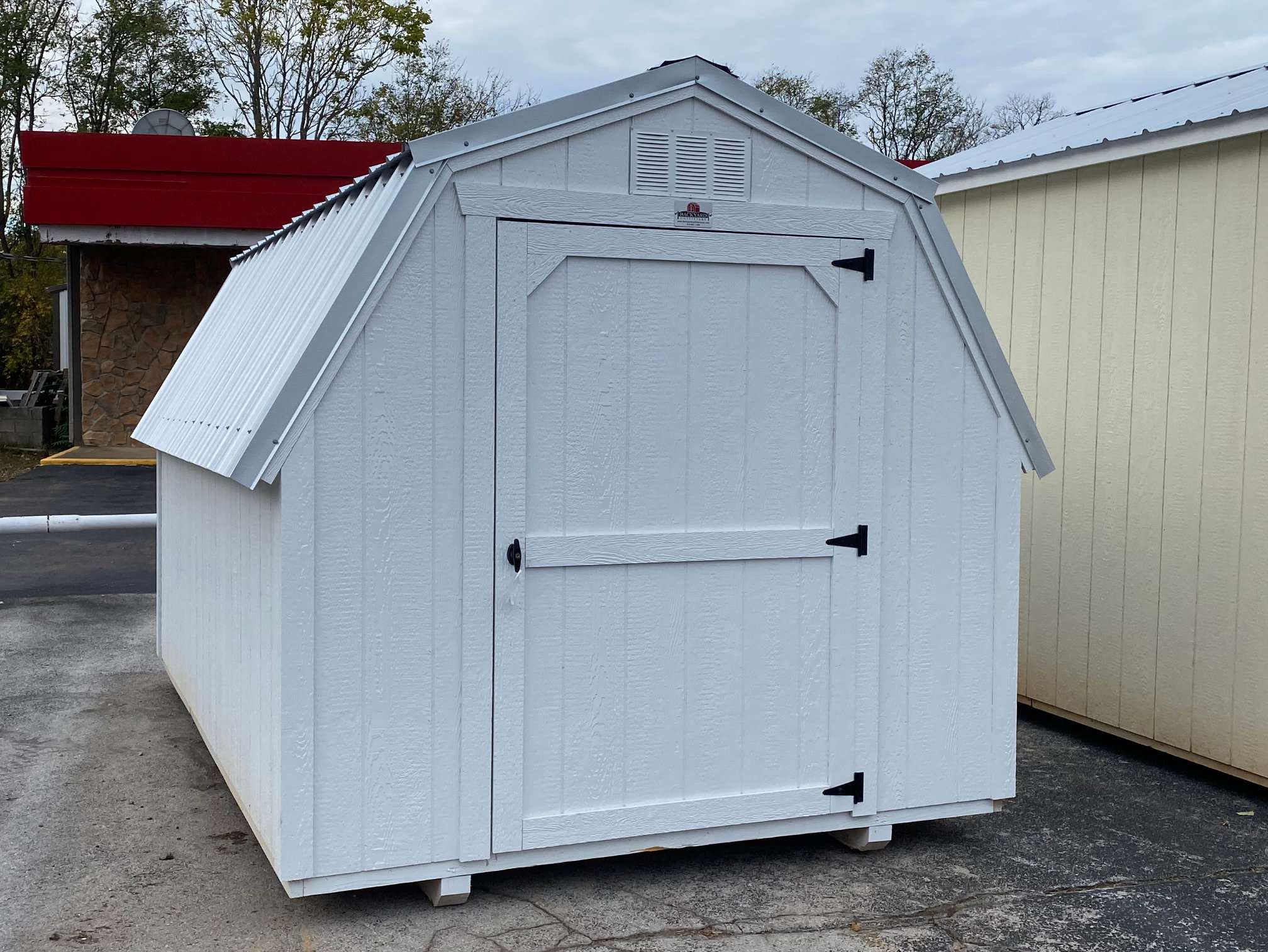 white 8x12 dutch barn with a 4 foot single door in the front