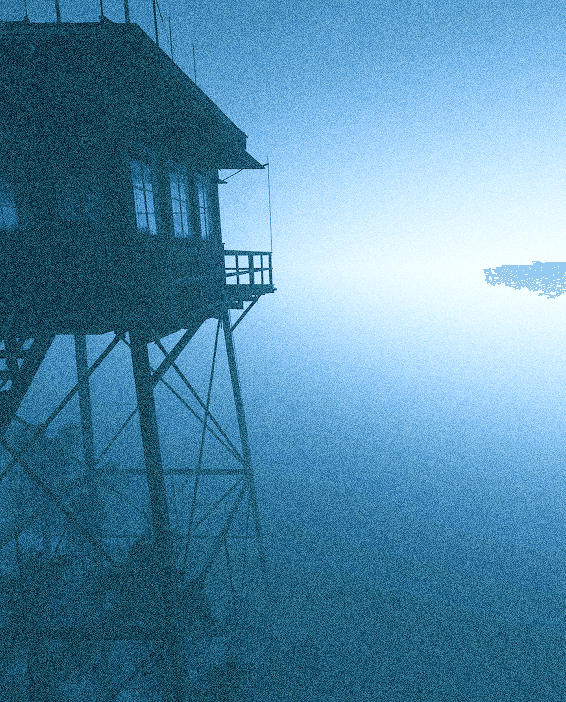 Silhouette of a tower against a blue sky.