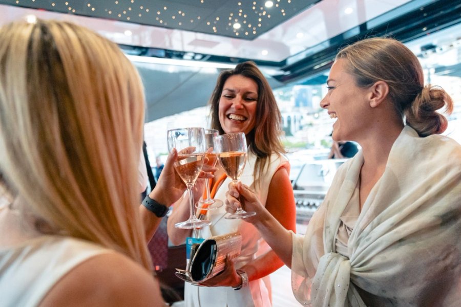 Guests toasting aboard a yacht at the Monaco Yacht Show