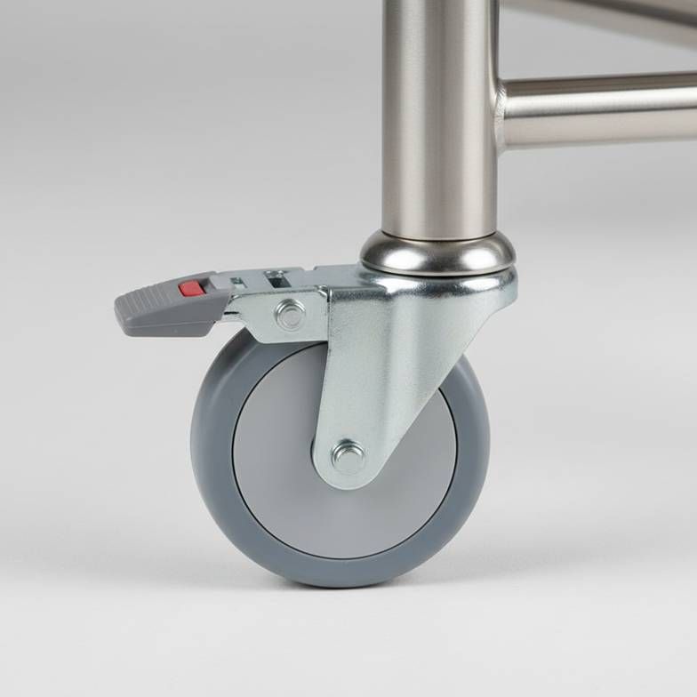 Close-up of a medical-grade caster wheel on a hospital trolley
