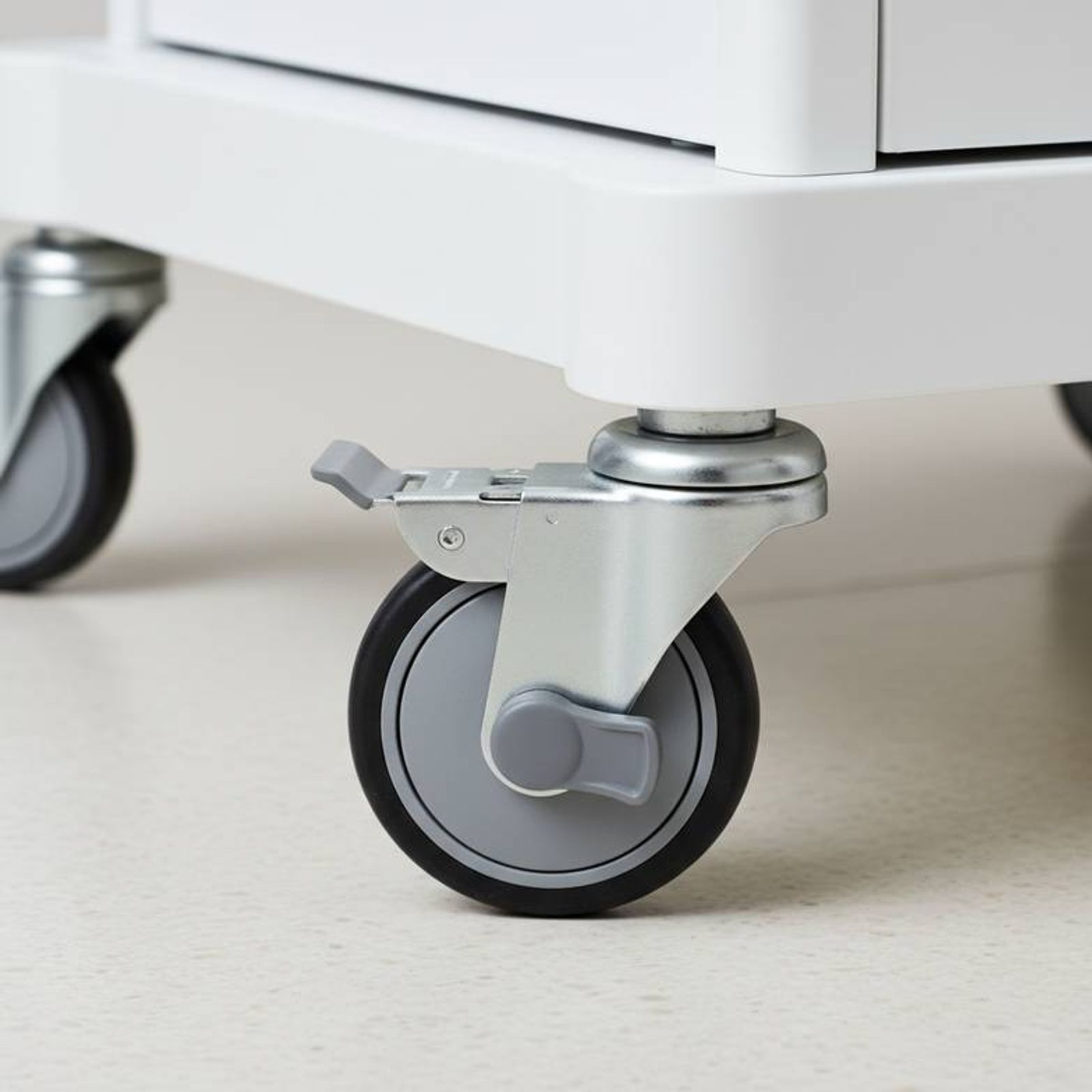 Close-up of a high-quality caster wheel on a resuscitation trolley specified for durability