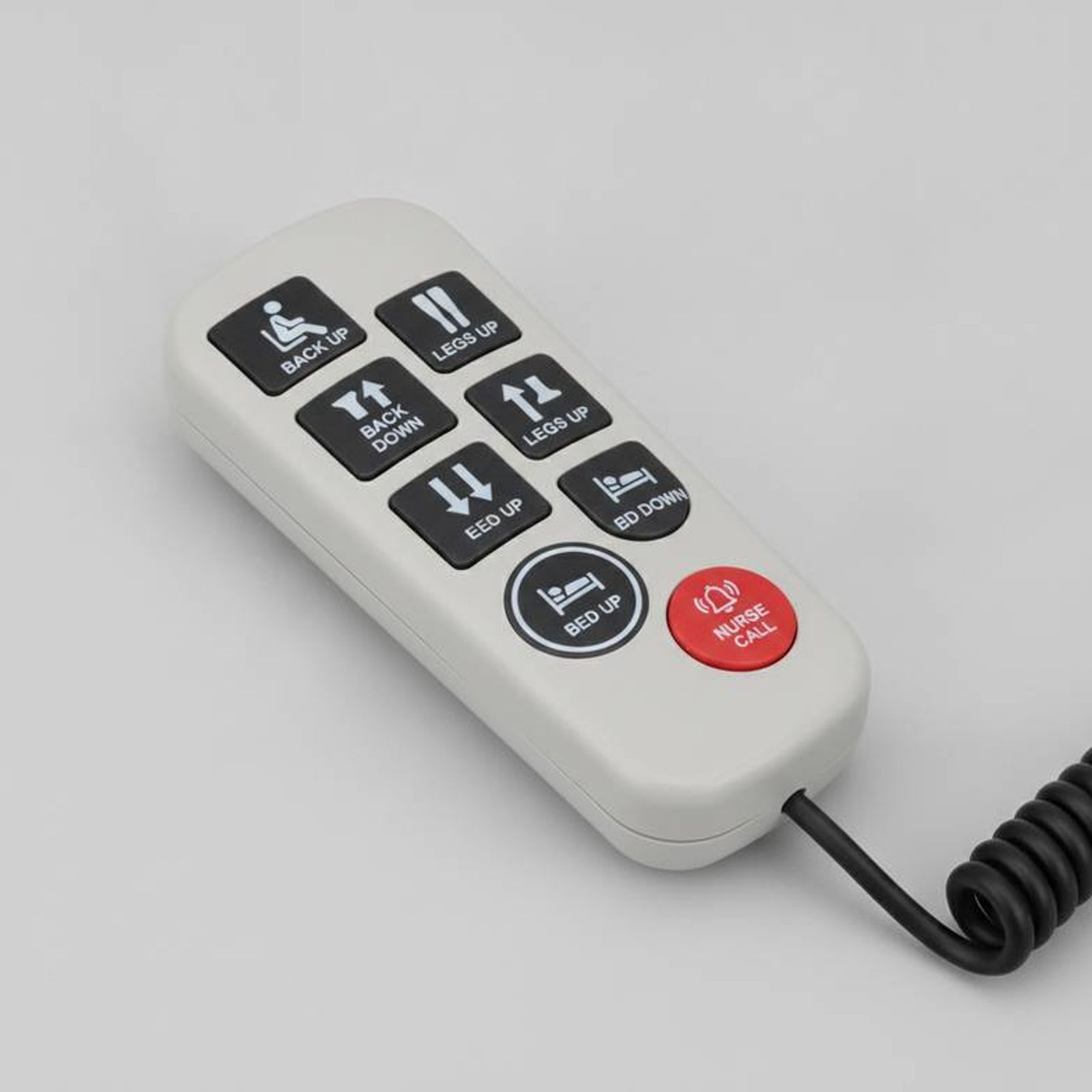 A close-up of a modern hospital bed hand control with clear icons and text labels.