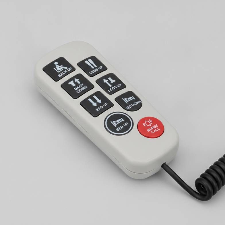 A close-up of a modern hospital bed hand control with clear icons and text labels.