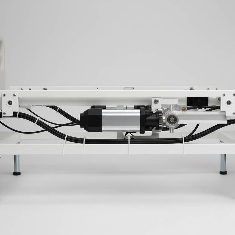A detailed view of a hospital bed's mechanism, highlighting components relevant to hospital bed preventive maintenance.