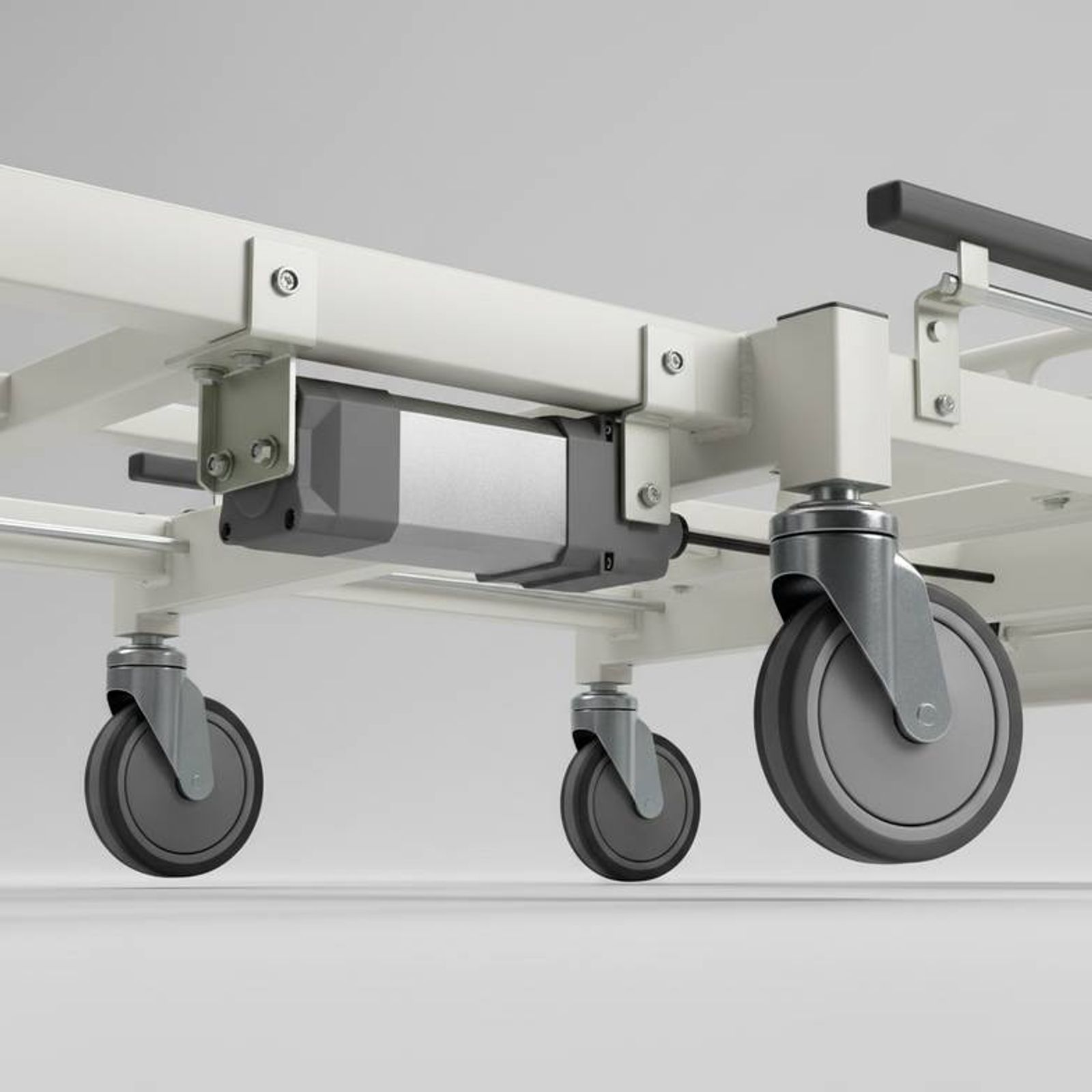 Close-up of a hospital bed motor and steel frame
