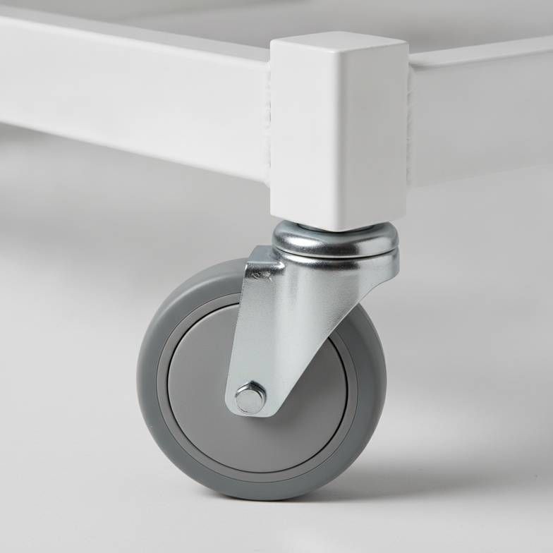 Close-up of a hospital bed's durable caster and steel weld, crucial for medical equipment distributors.