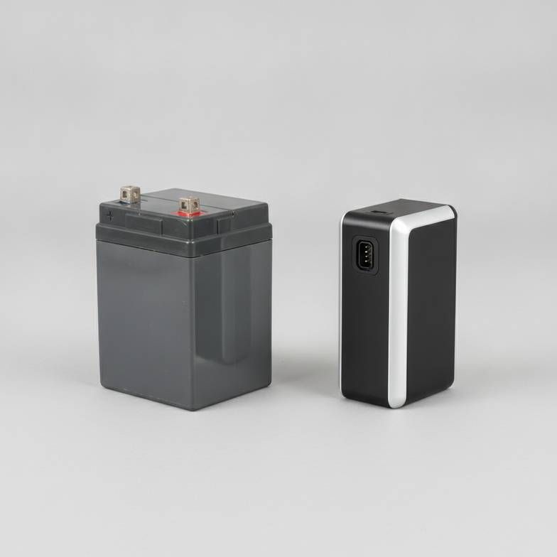 A diagram comparing a traditional sealed lead-acid battery next to a modern, lighter lithium-ion battery used in a hospital bed battery backup system.