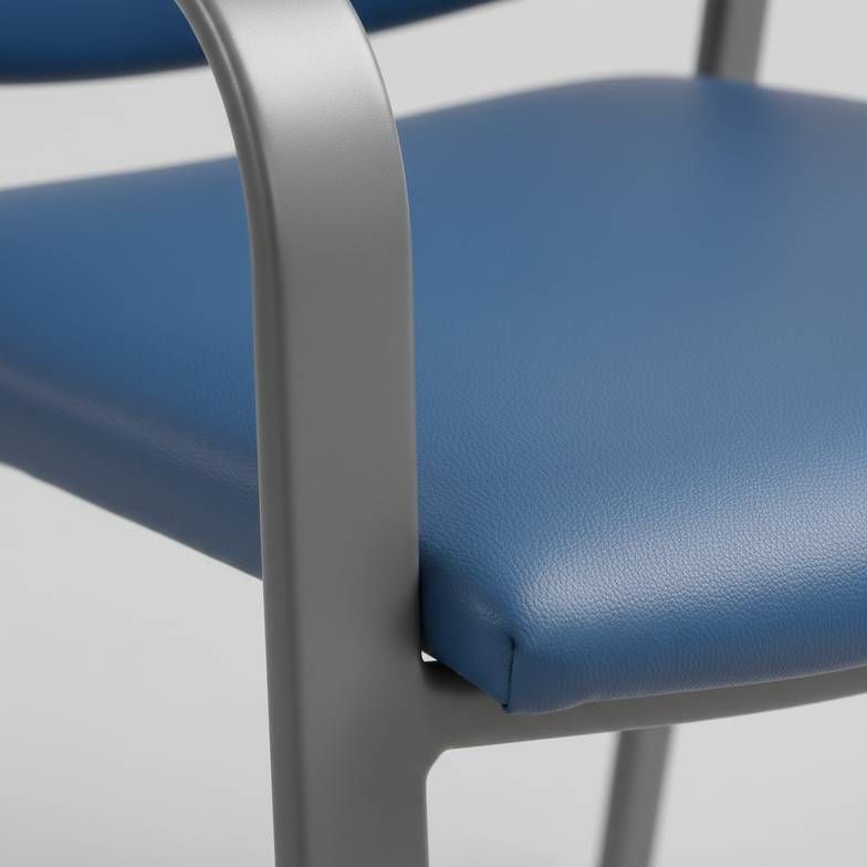 Close-up of the powder-coated steel frame and vinyl upholstery on a hospital waiting chair.