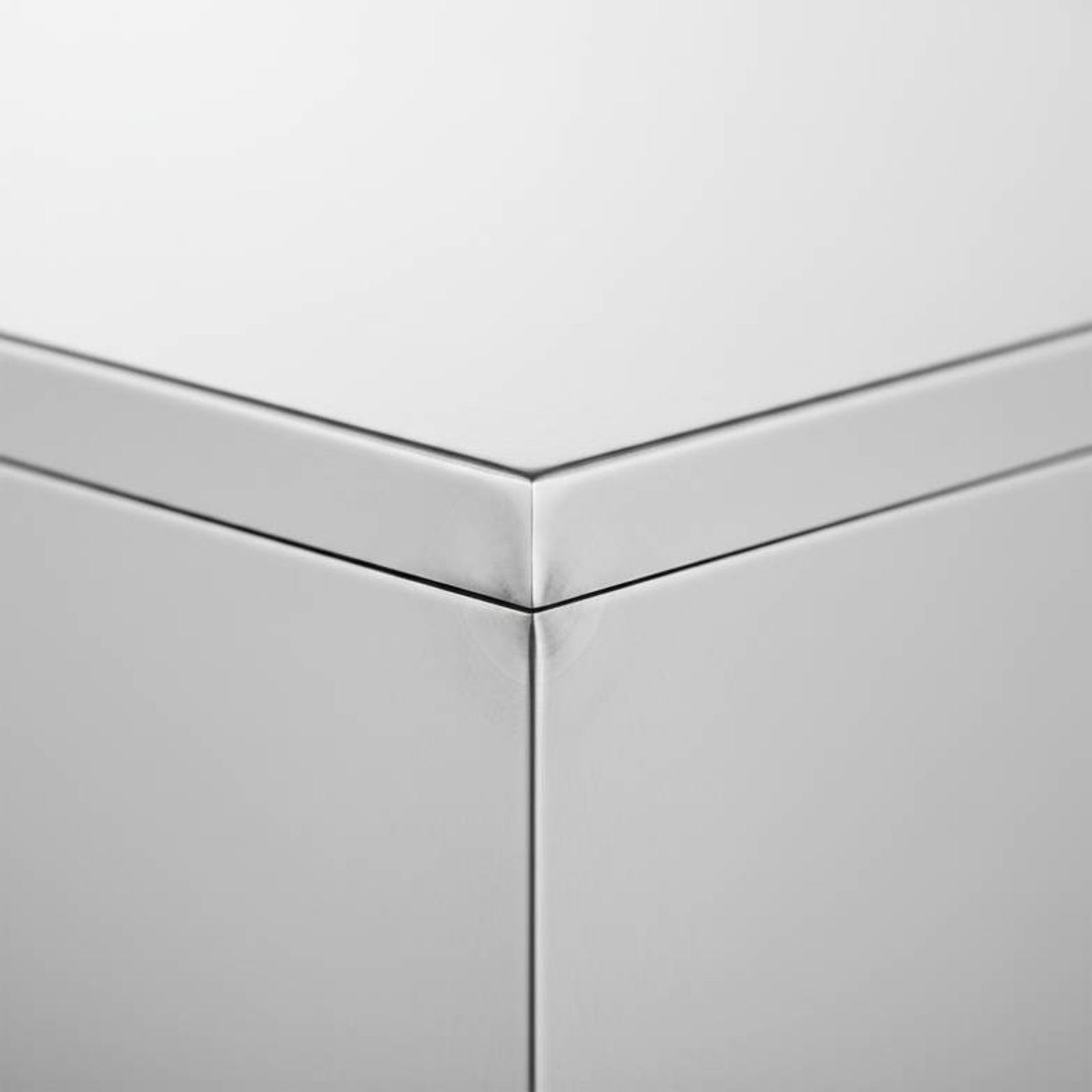 A perfectly polished and smooth weld on a stainless steel medical sink, demonstrating a finish that prevents hygiene-related medical furniture defects.