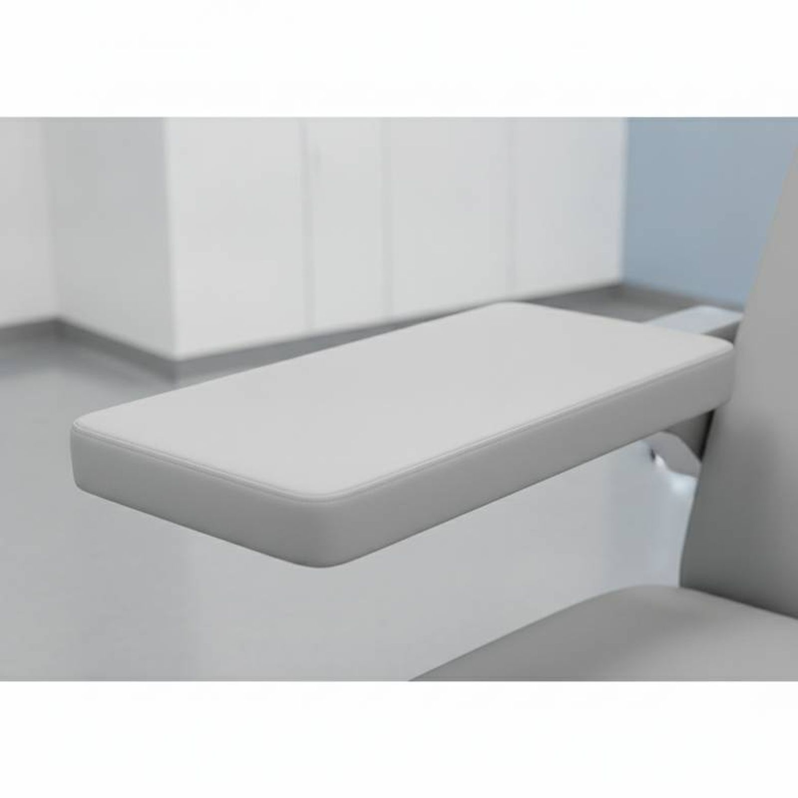Close-up showing the flat, wide armrest of an infusion chair.