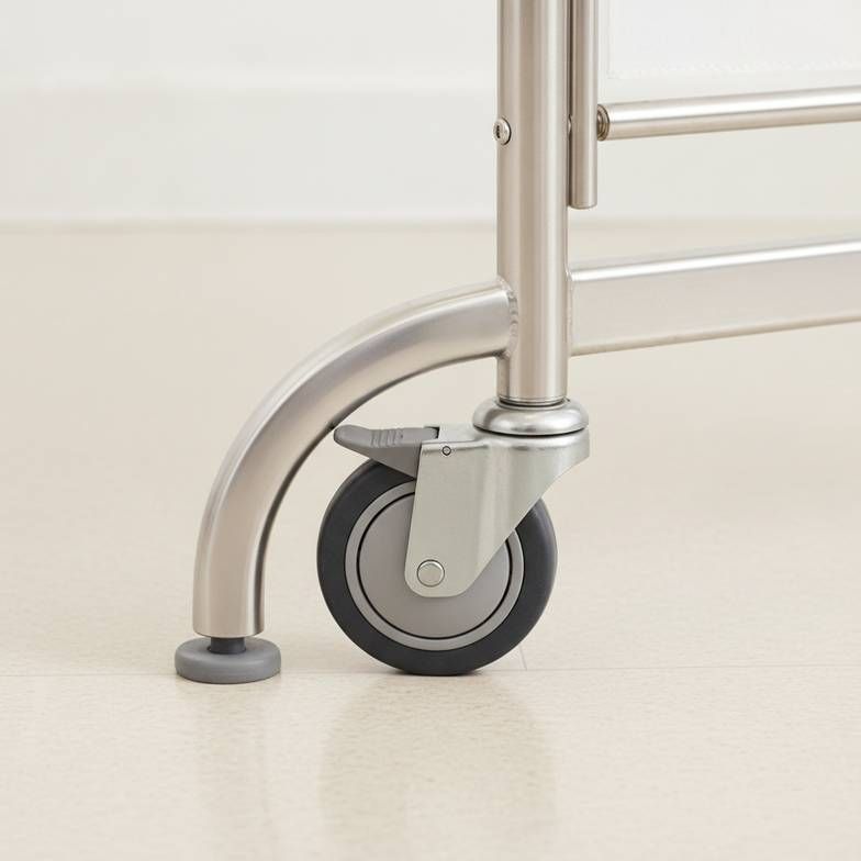 A close-up image showing the base and locking caster of a mobile hospital screen.