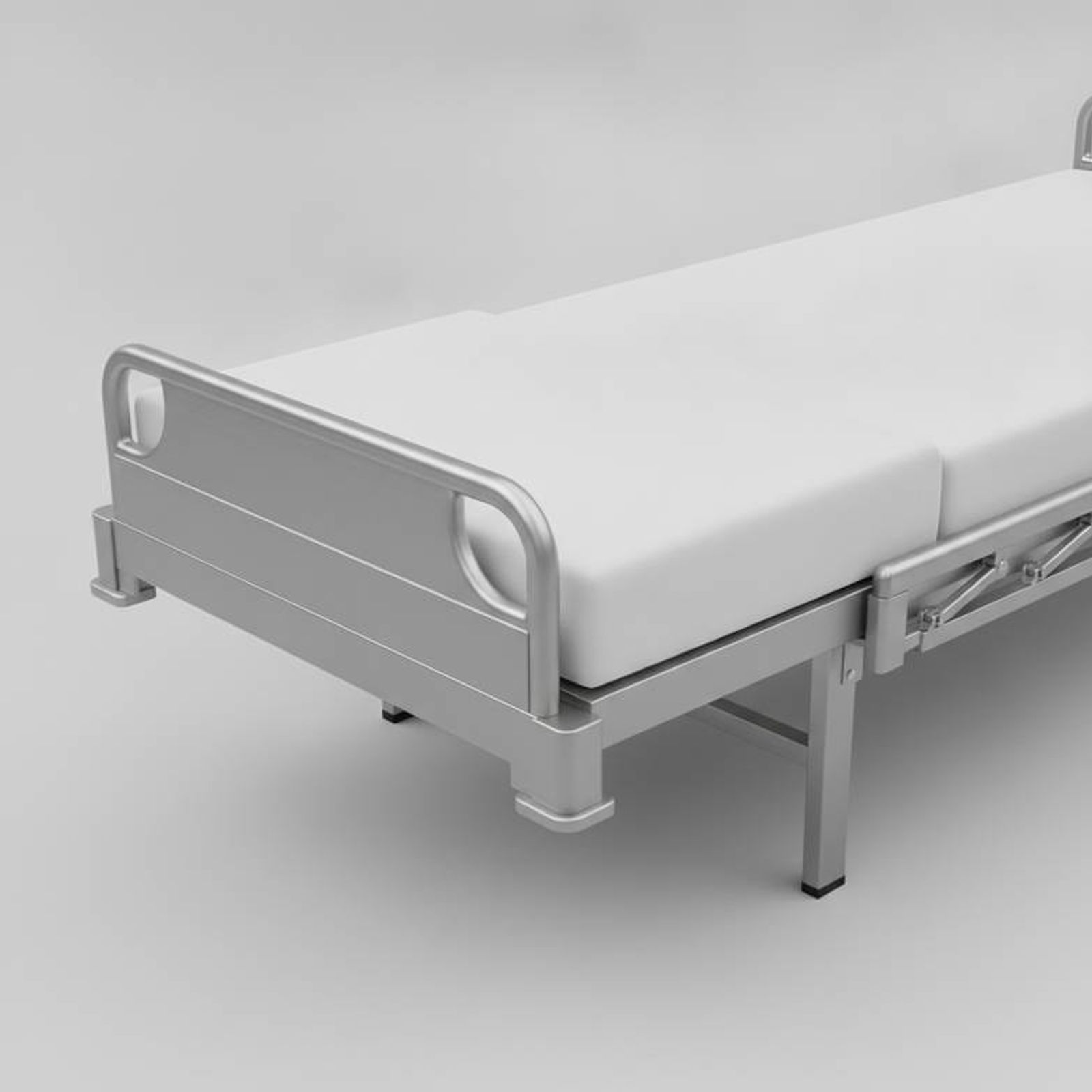 A hospital bed shown with both the frame extension and a matching mattress extender piece, creating a seamless surface.