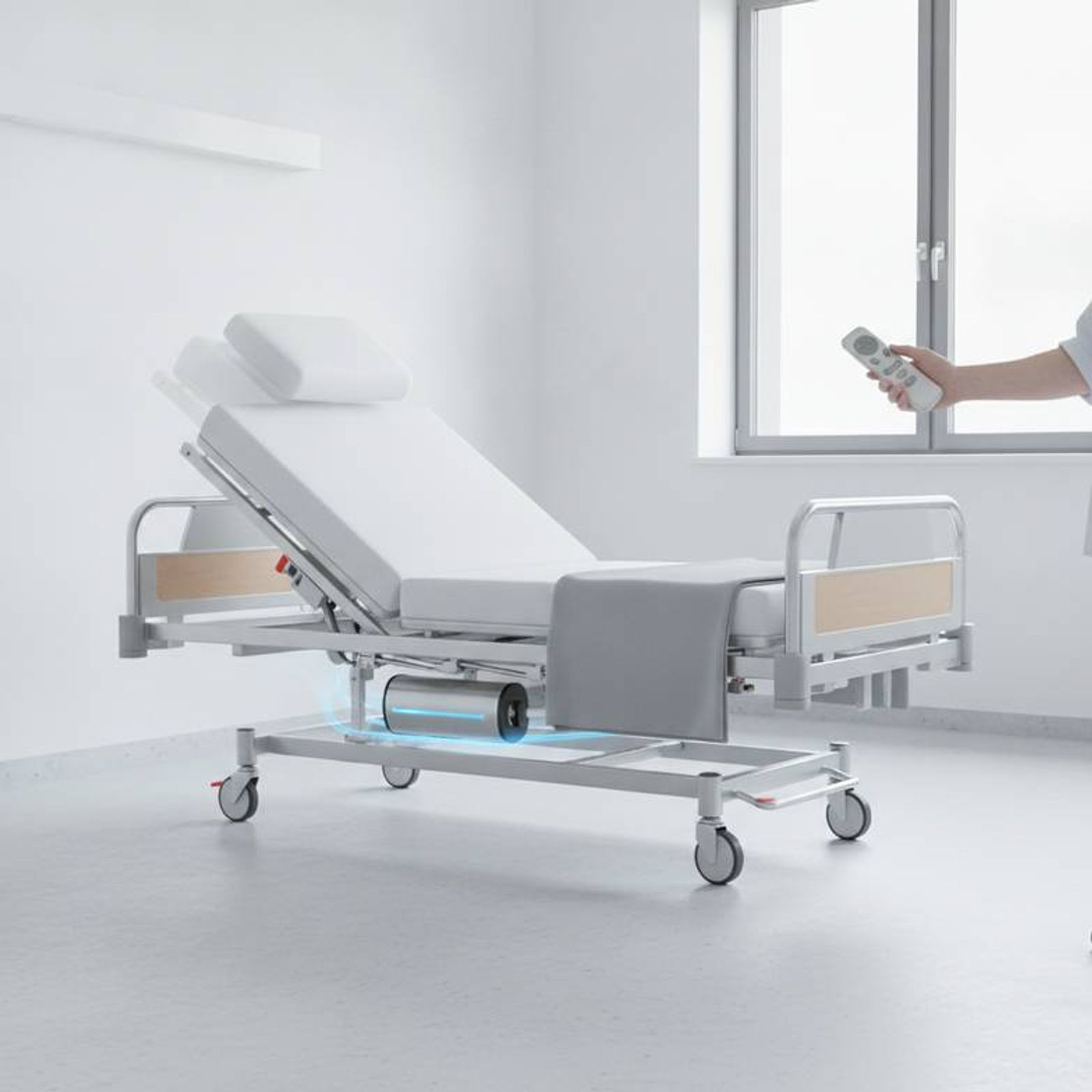 A nurse using the handset to adjust an electric hospital bed, demonstrating the critical functions powered by the hospital bed battery backup during a simulated