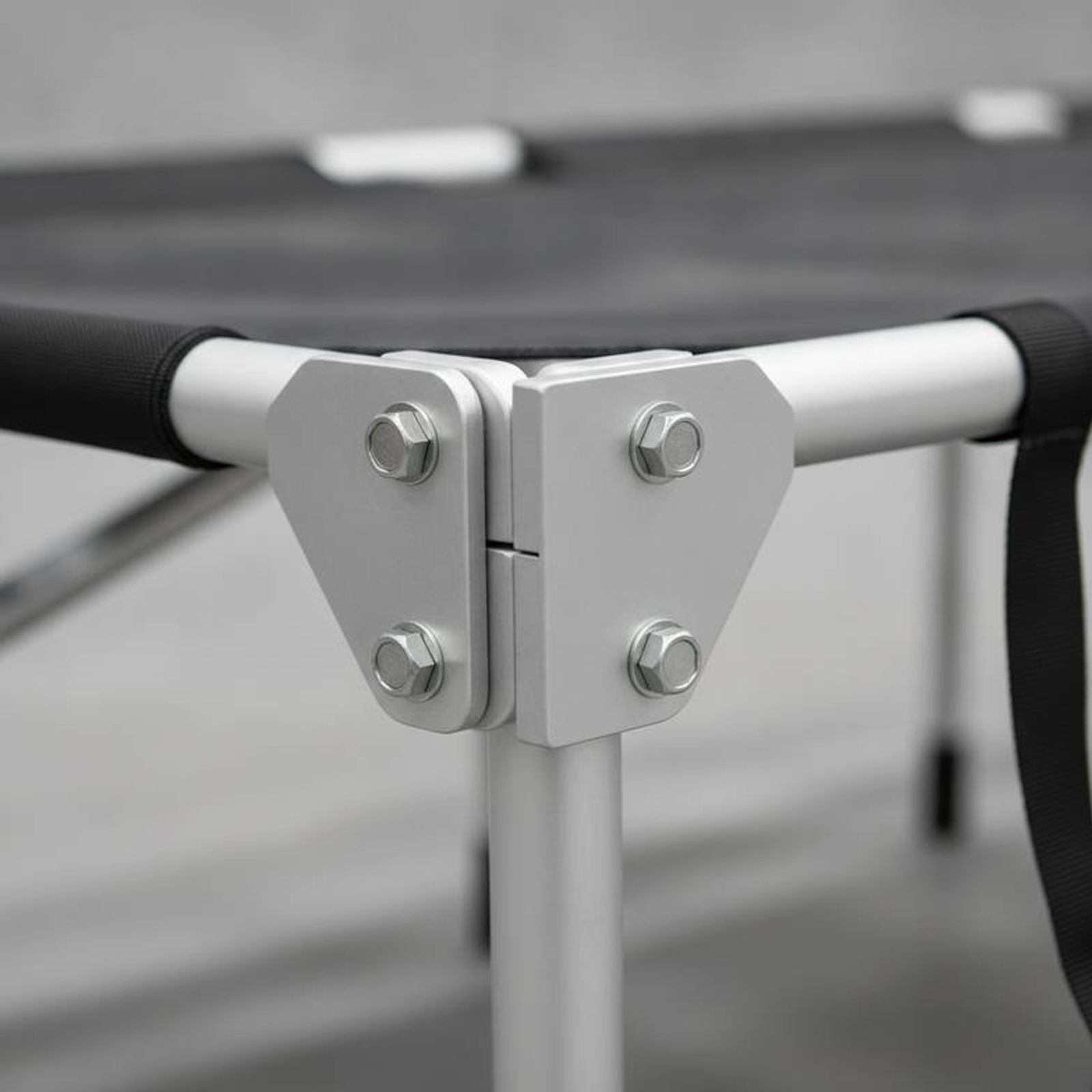 Close-up of the reinforced joint on an aluminum portable folding stretcher frame