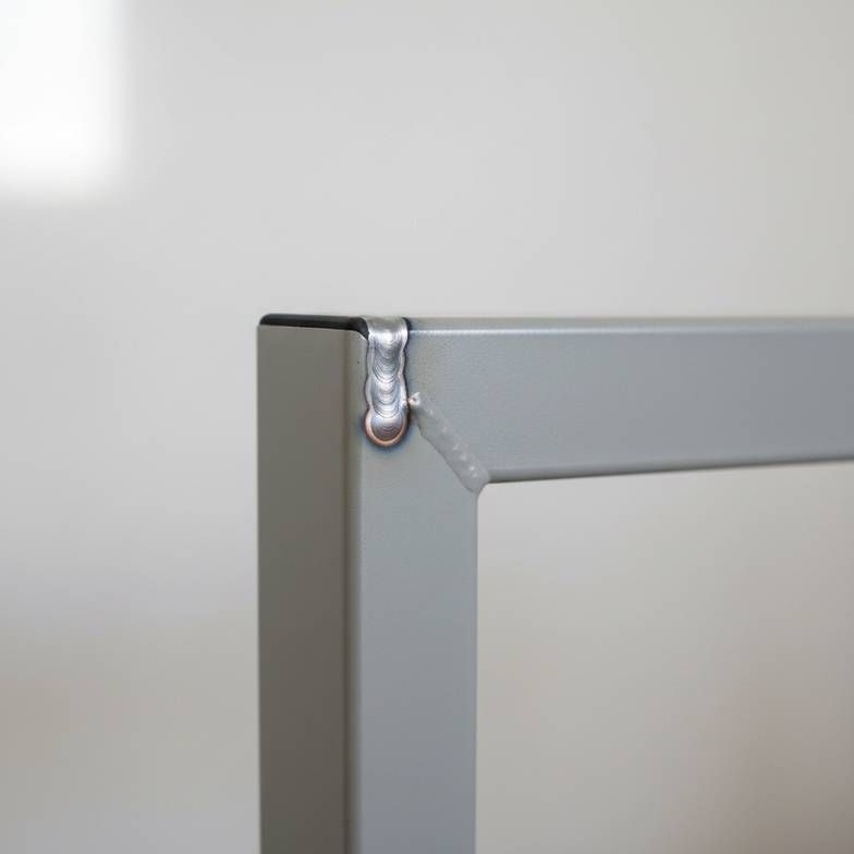 A detailed shot showing a clean, strong weld on the joint of a hospital waiting chair frame.