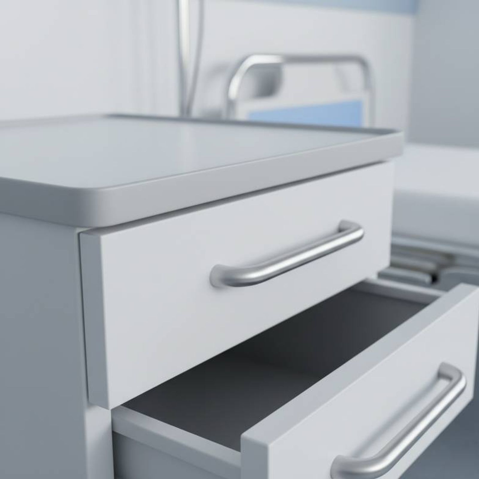 A close-up of a hospital bedside cabinet showing its material, surface finish, and drawer handles.