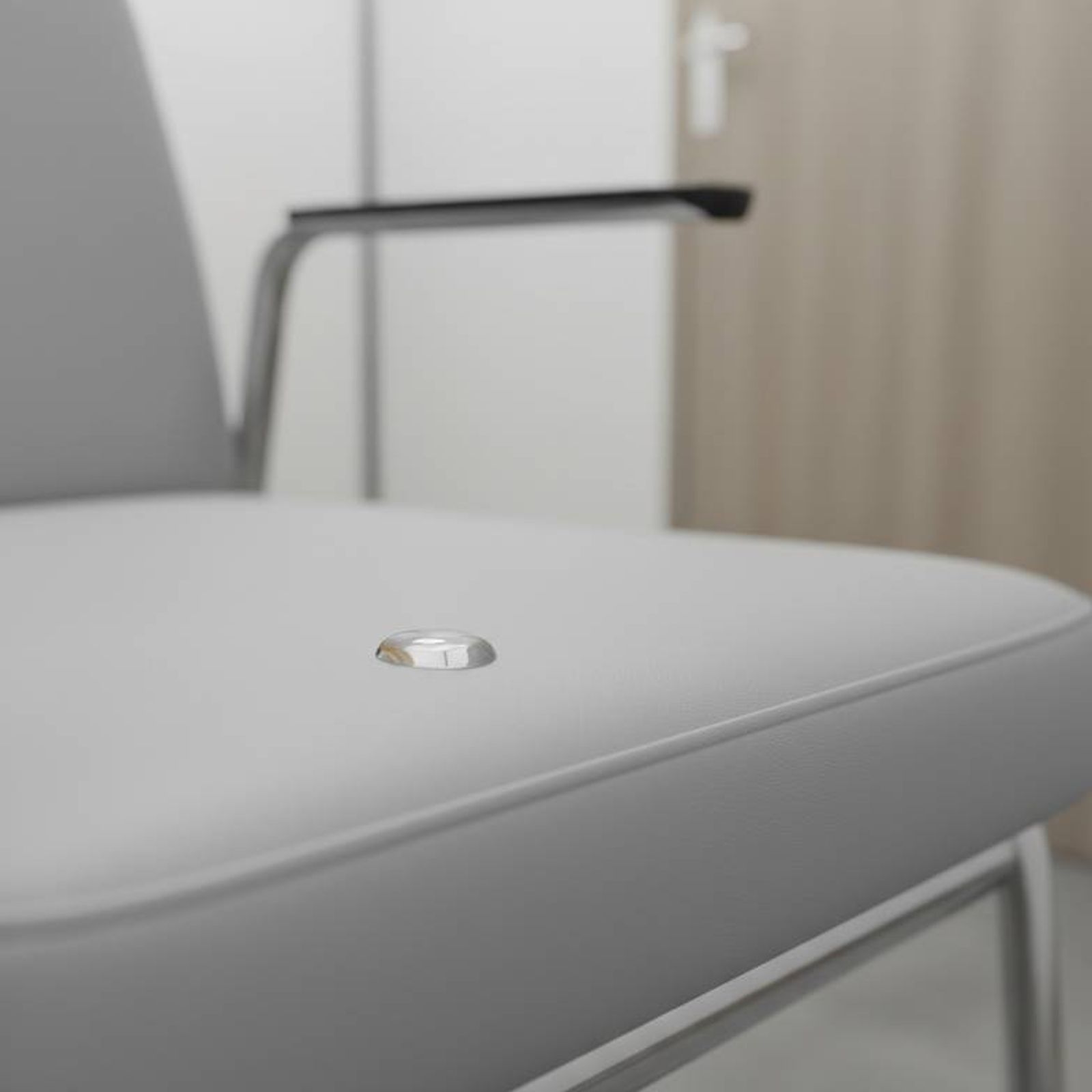 Close-up of medical-grade vinyl on a patient chair for a consultation room, showing a seamless and easy-to-clean surface