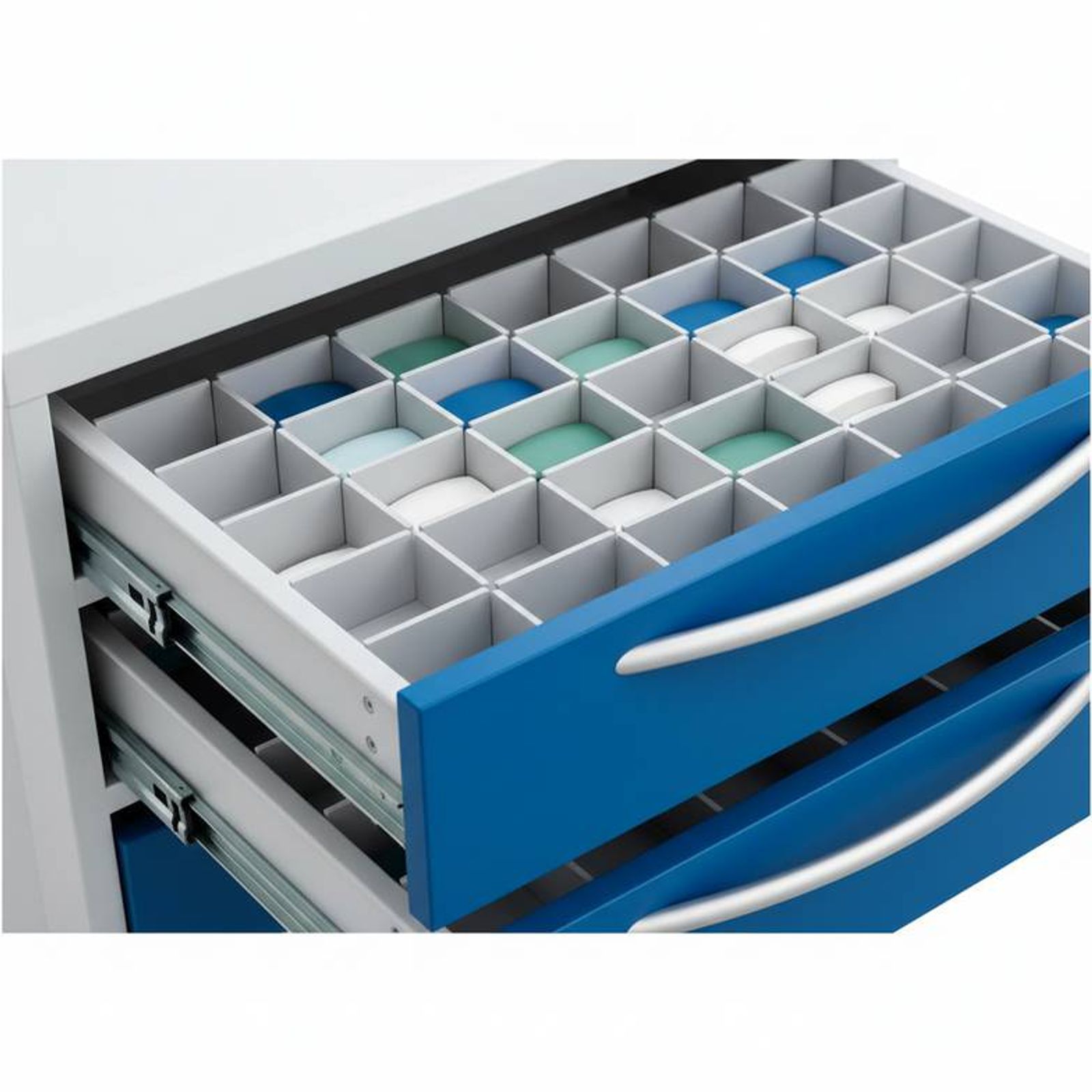 A close-up shot of an emergency trolley's drawers, showing different sizes and internal dividers for organizing medical supplies.