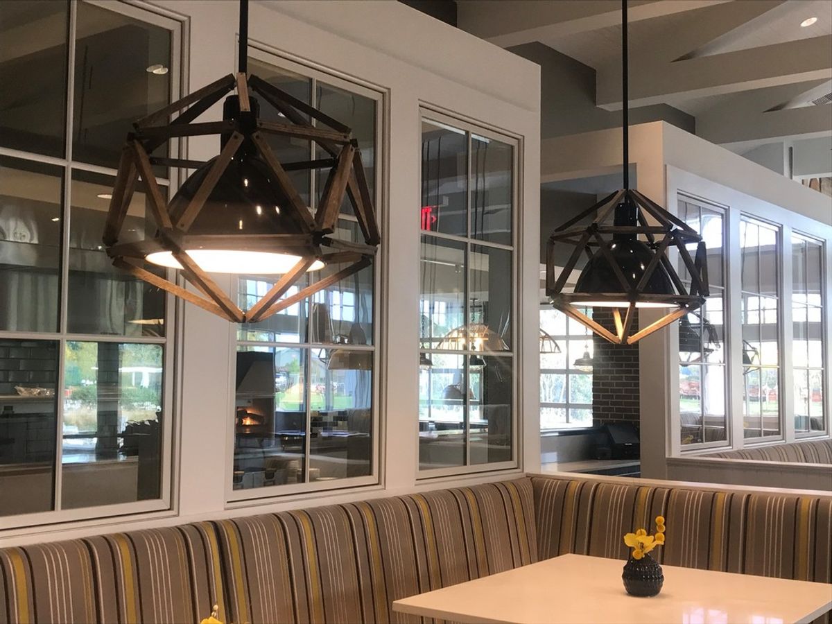 This unique install at Trilogy Lake Norman Clubhouse features many different materials. Custom design in collaboration with Design Lines, Inc.