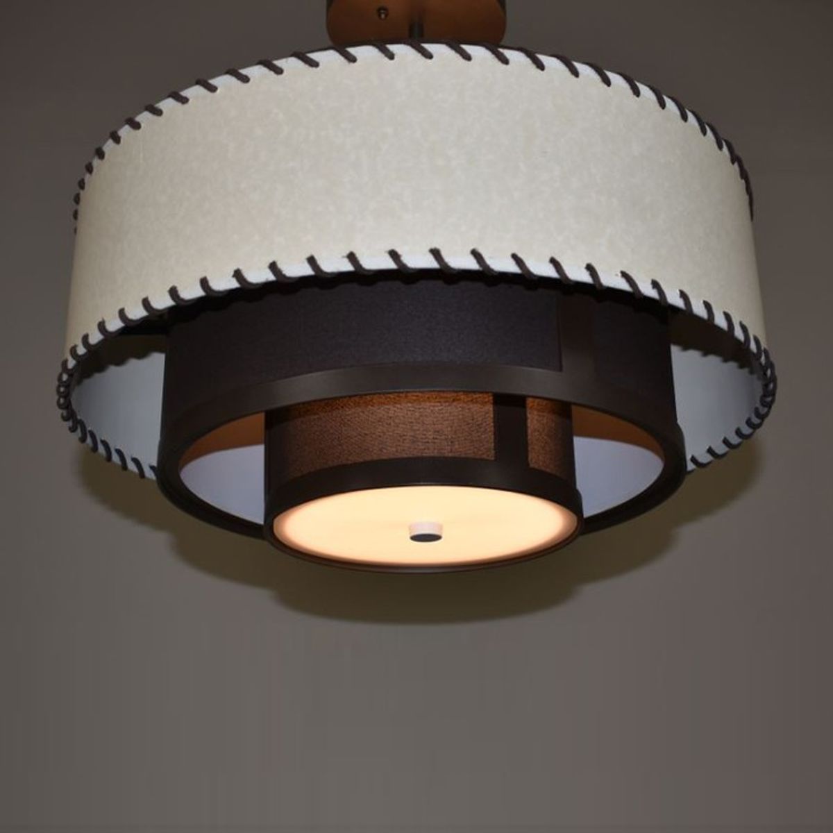 New Pendant 
Made in the USA
RL-3-1484
20"D x 13"H x 18"OAH
Cappuccino Powder Coat
Outer Shade - Marble Beige Paper w/ Stitching
Inner Shade - Cappuccino Lin…