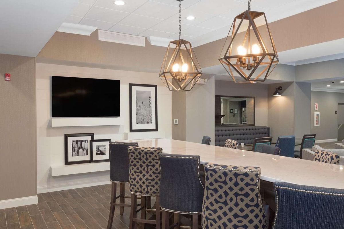 Our geometric pendant light fixtures in these images feature warm, ambient lighting that enhances the modern yet inviting aesthetic of this space. The unique…