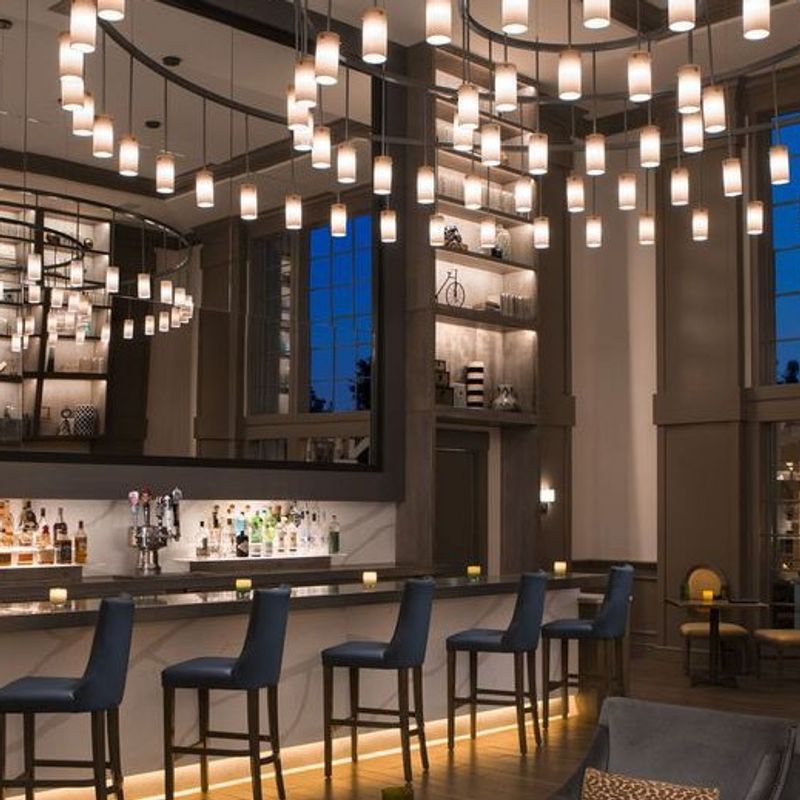 This stunning 204" diameter custom chandelier sets the tone at River Terrace Inn in Napa Valley—elegant, bold, and unforgettable. Its sculptural presence bri…