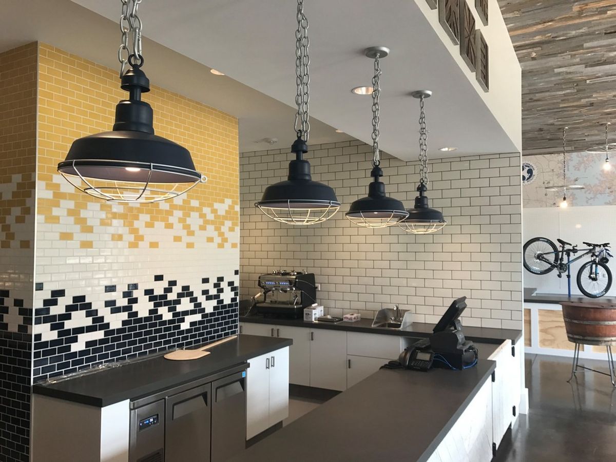 This unique install at Trilogy Lake Norman Clubhouse features many different materials. Custom design in collaboration with Design Lines, Inc.