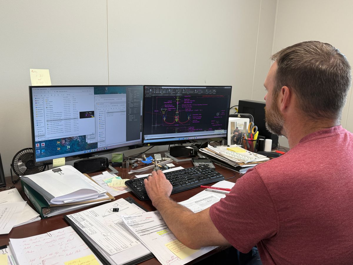 Engineer reviewing chandelier CAD drawings