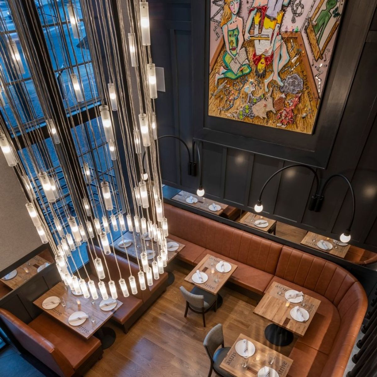 Step inside Strive Kitchen & Bar, where our massive chandelier and sleek wall sconces bring dramatic lighting and elevated style to every corner of the space…