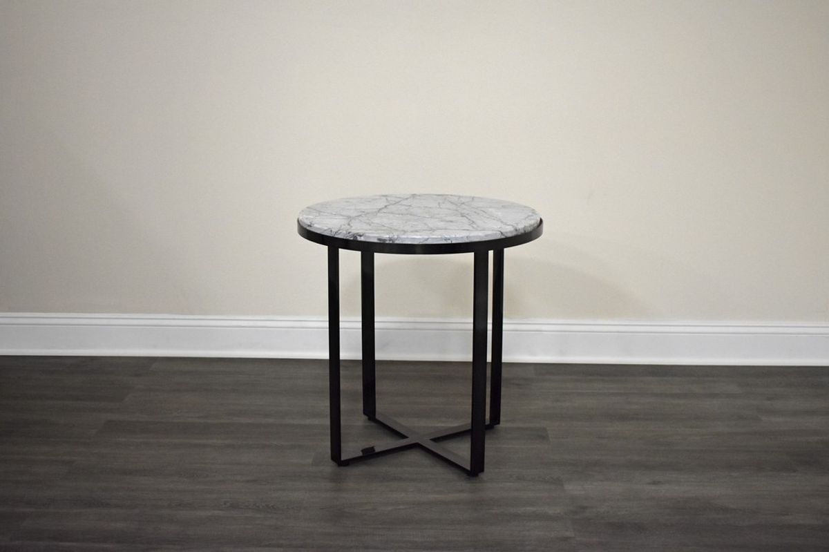 This beautiful group of tables were manufactured right here in the USA.

Finish: Brushed Smokey Translucent Black
Top: White Carrera Marble

RF-T-0100-24-20…