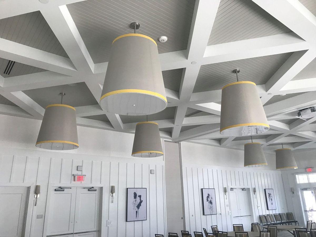 This unique install at Trilogy Lake Norman Clubhouse features many different materials. Custom design in collaboration with Design Lines, Inc.