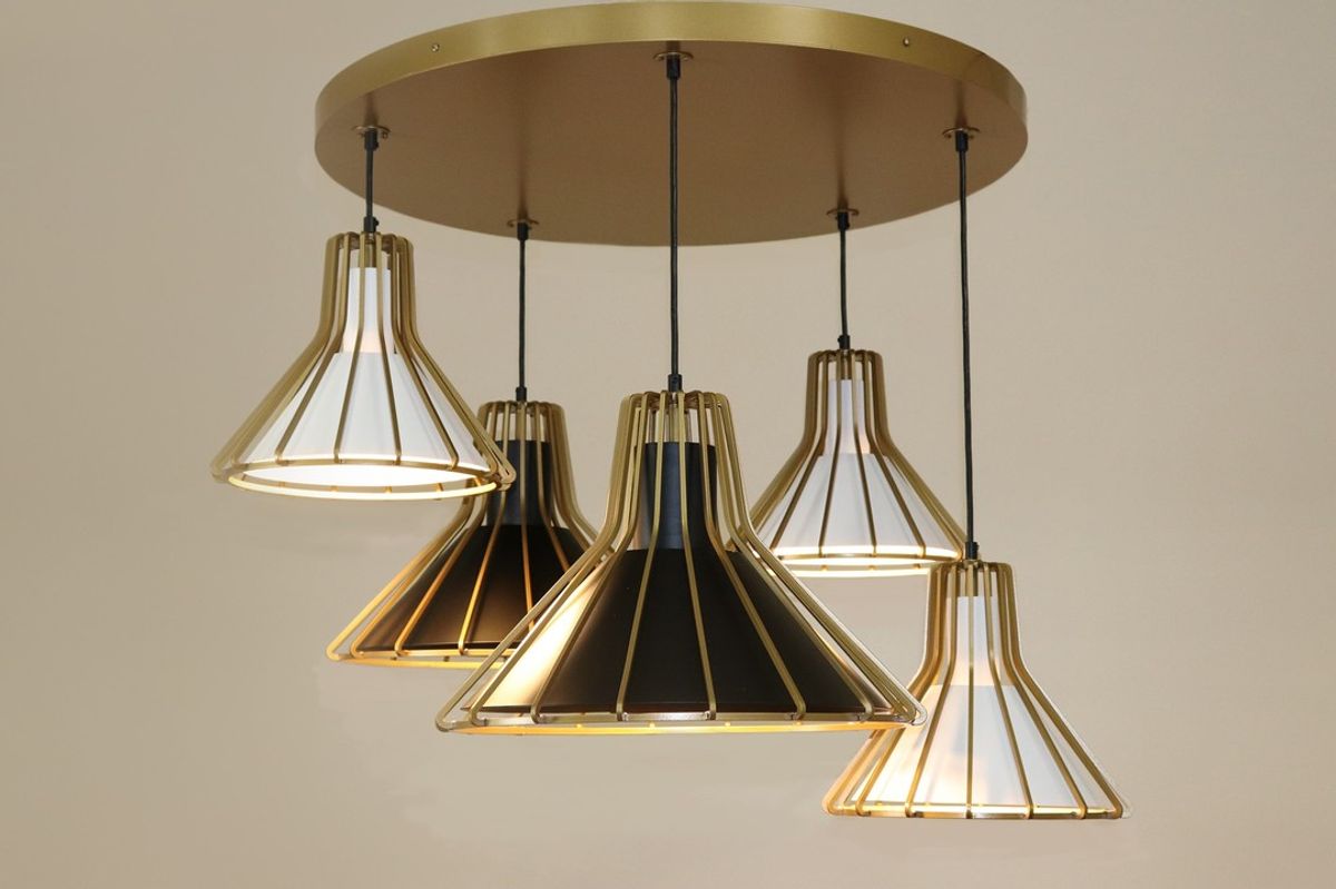 Custom made pendant built in Roanoke, VA, USA. Featuring Bright Gold Powder Coat on the canopy and outer ribbed frames, Black Star Powder Coat on the large i…