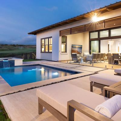 Dusk view of the pool and outdoor living space.