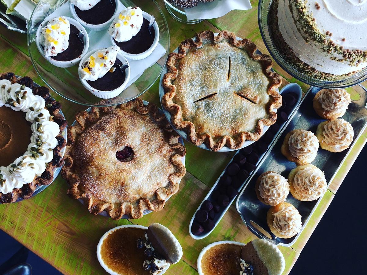 An indulgent dessert spread at Se7en Bites bakery with homemade pies, cakes, cookies, and cream-filled treats. A sweet lover’s paradise in Orlando.