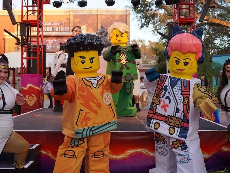 LEGO ninjago characters entertaining kids on stage at LEGOLAND Florida. A fun-filled experience that makes Orlando one of the best theme park destinations.