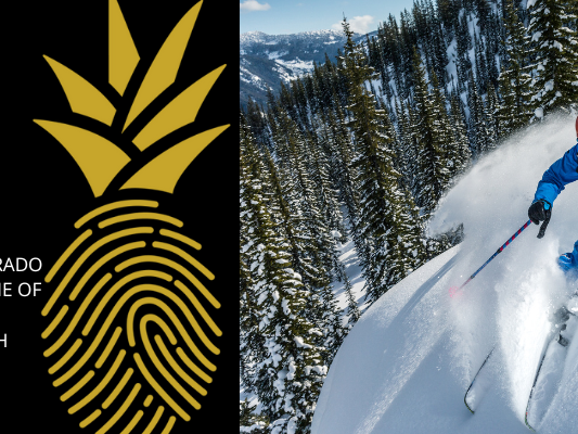 person skiing on top of a mountain