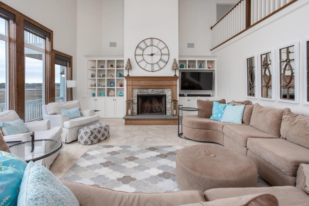 Living room with ocean views in a Holden Beach vacation rental.