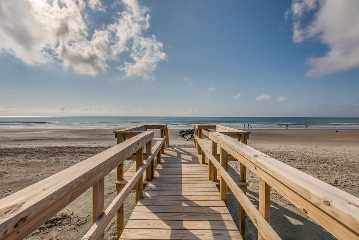 Private boardwalk to the beach at a Folly Beach vacation rental.