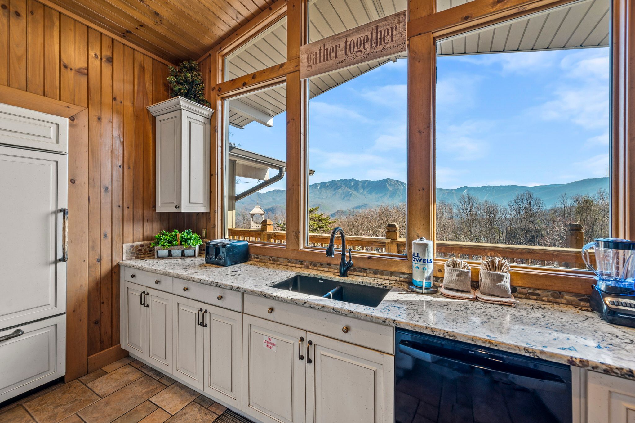 View from kitchen window of mountains with paper towel holder