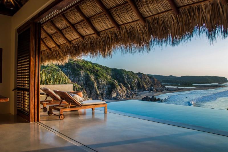 Relax poolside at a Huatulco vacation rental