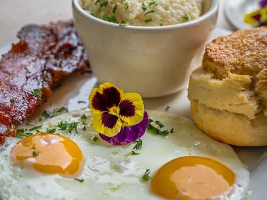 Bright, welcoming breakfast at Sunny Point Café, known for fresh, farm-to-table dishes, colorful plates, and a relaxed, garden-inspired ambiance.