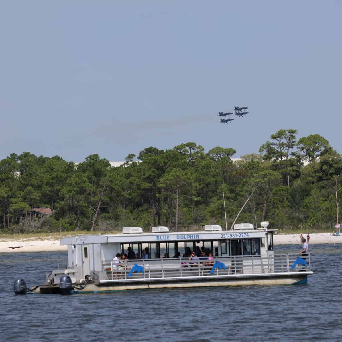 Guests enjoy a scenic ride aboard Blue Dolphin Cruises in Perdido Key, a family-friendly way to spot dolphins and take in the waterfront views.