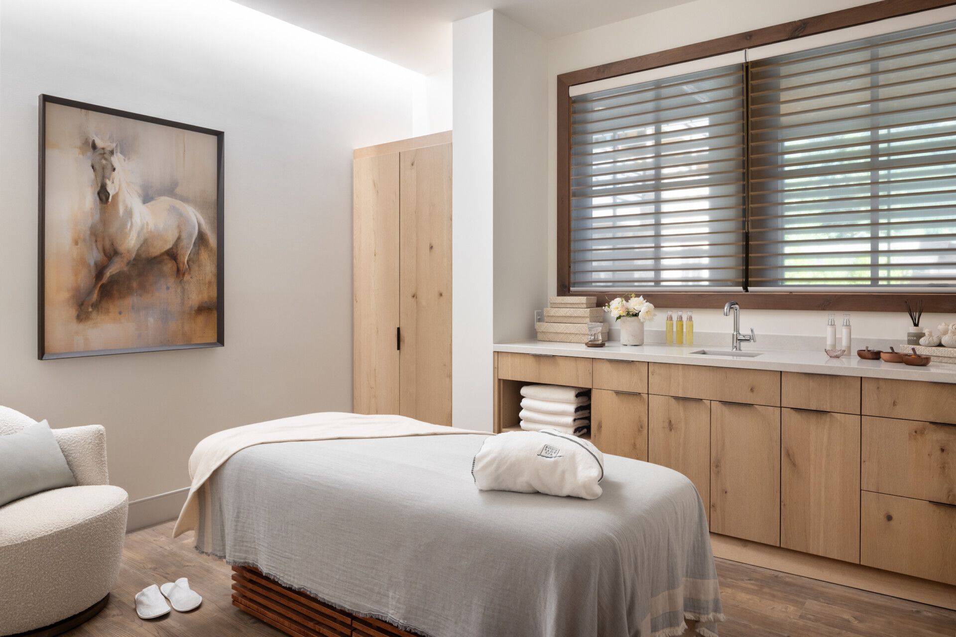 A serene treatment room at Body Sage Spa inside the Rusty Parrot Lodge features warm wood tones and a massage table ready for guests. The space feels quiet, cozy, and designed for deep relaxation. It’s a popular spa choice in downtown Jackson.