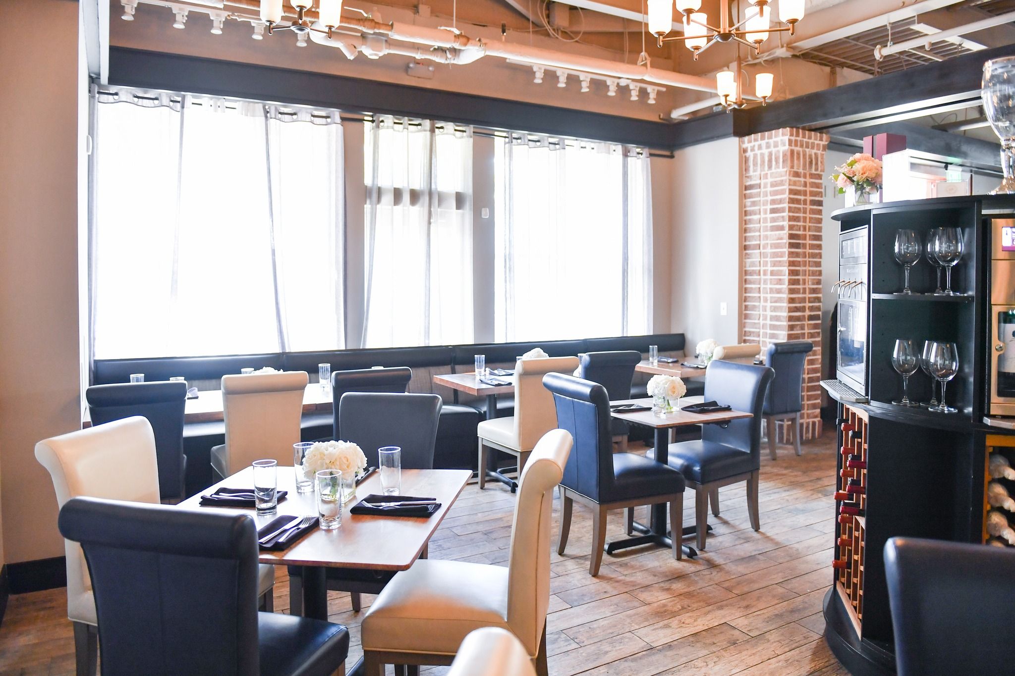 The interior of FortyEight Wine Bar with elegant seating, warm lighting, and a relaxed dining setup. It’s a great place to enjoy wine, small plates, and intimate conversations.