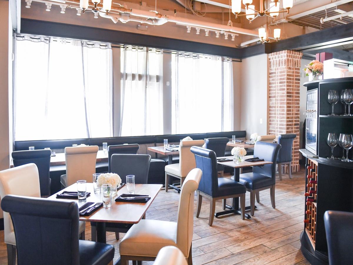 The interior of FortyEight Wine Bar with elegant seating, warm lighting, and a relaxed dining setup. It’s a great place to enjoy wine, small plates, and intimate conversations.