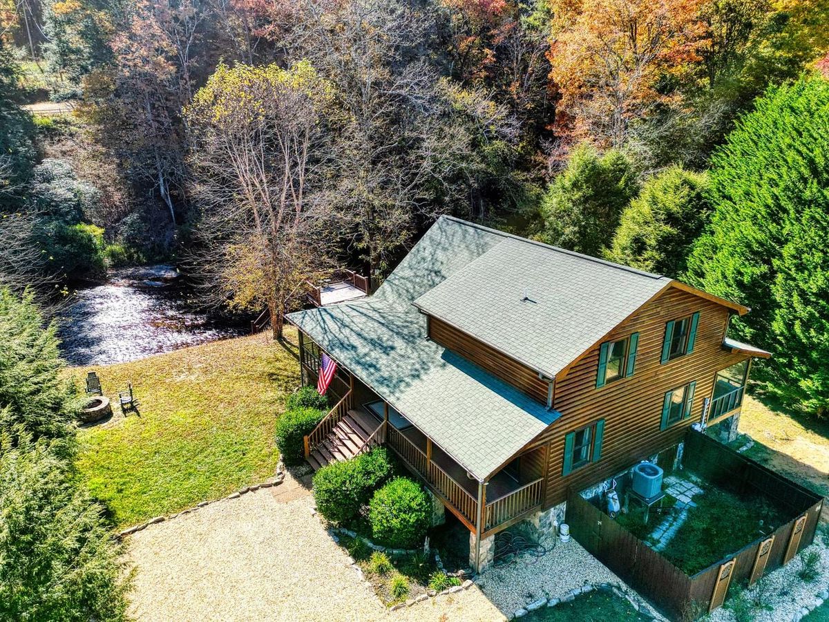 Tucked next to the river, this quiet cabin has a large deck and fire pit surrounded by nature. Small and homey, it’s the perfect place to relax after hiking, with a private hot tub for stargazing.